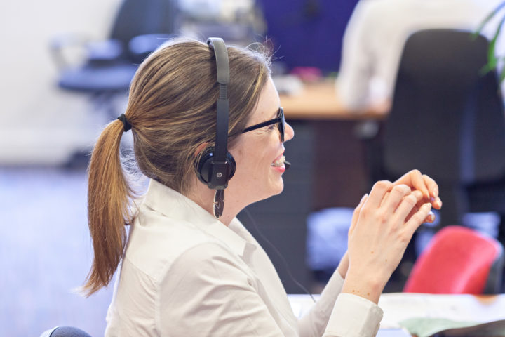 A dedicated account manager talking to a contractor on the phone. 